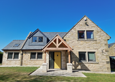 detached house with yellow door and porch